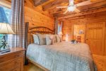 Main Level Bedroom Features King Size Bed, Flat Screen TV, & Access To Covered Deck
